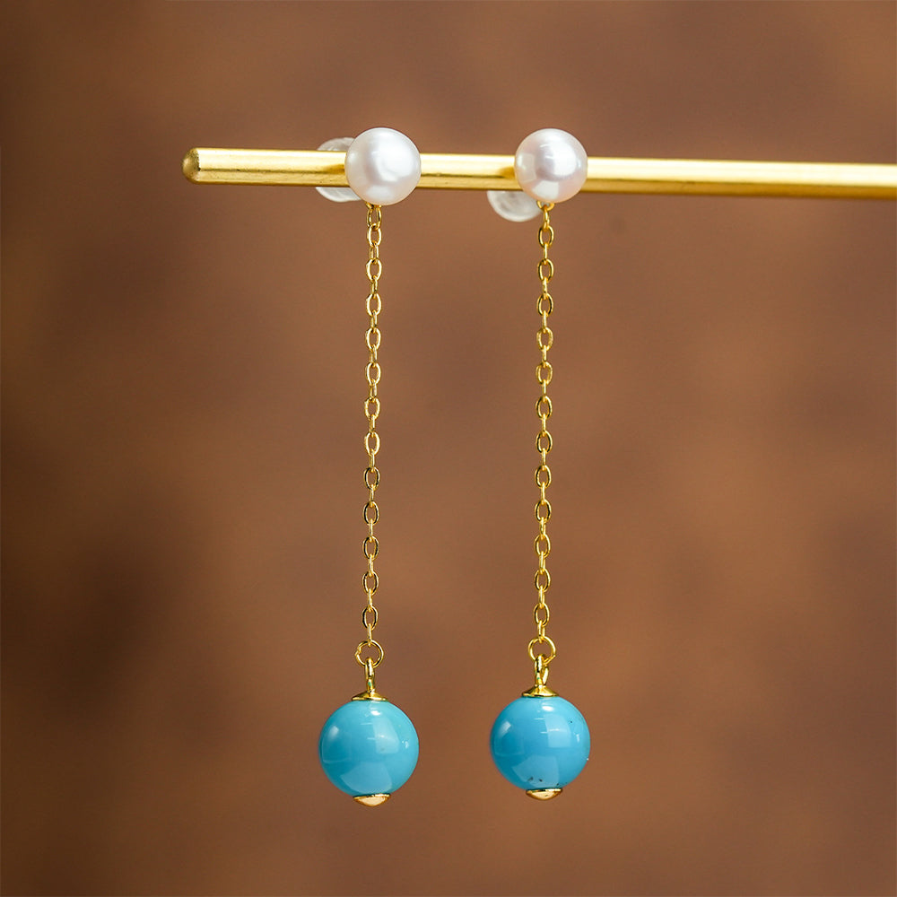 Elegant gold chain earrings with white pearl studs and turquoise gemstone beads