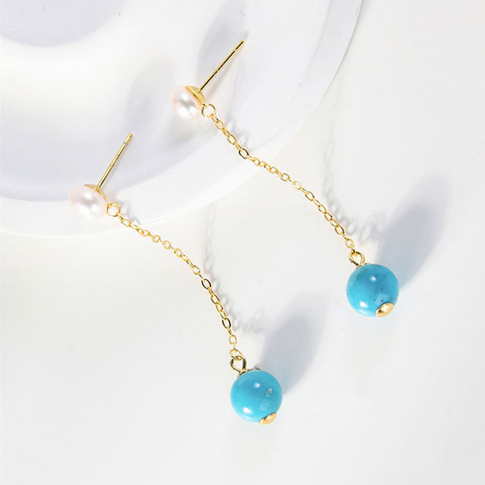 Gold-plated dangle earrings with white pearls and turquoise gemstone beads on delicate chains