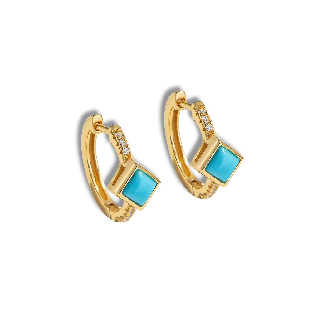 Gold plated hoop earrings with square turquoise stones and small clear crystals on white background