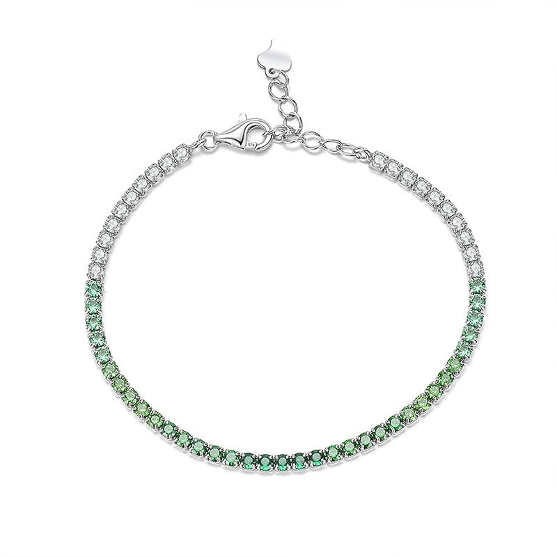 Delicate silver bracelet with alternating green and clear gemstones, adjustable chain clasp